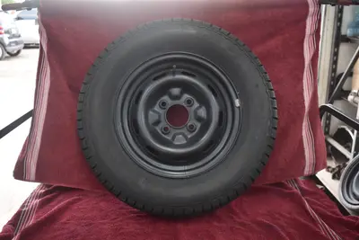 71-71.5 Datsun 240Z spare tire + wheel + OE stem NEVER USED beautiful OEM tire